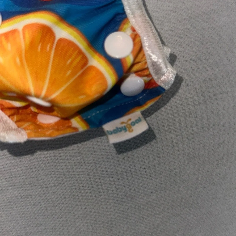 Kids OS Vibrant Orange and Blue Kids Diaper Cover.
